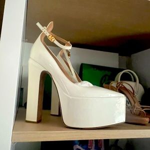 Valentino Tan-Go Patent Leather Pumps in white.